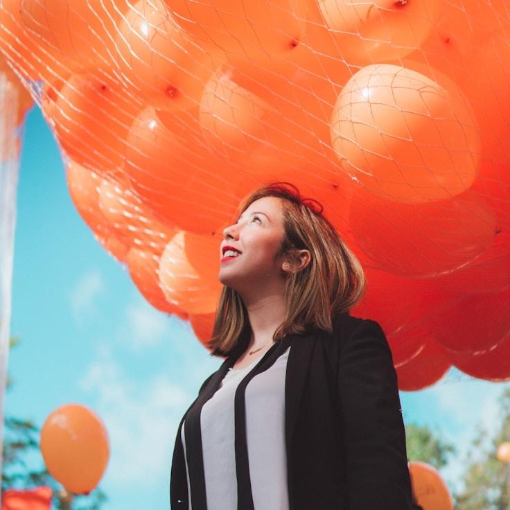 Kaveri Mehta, Lead Design Curator at Studio Folio Ledger, reviewing corporate floral arrangements